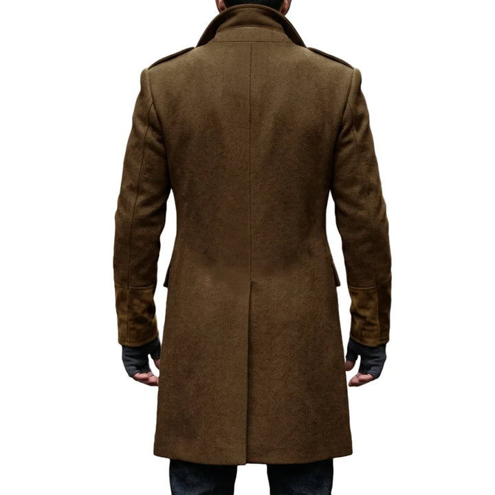 Back view of the brown overcoat on a model, showing the center seam, epaulettes and suede-look cuffs 18