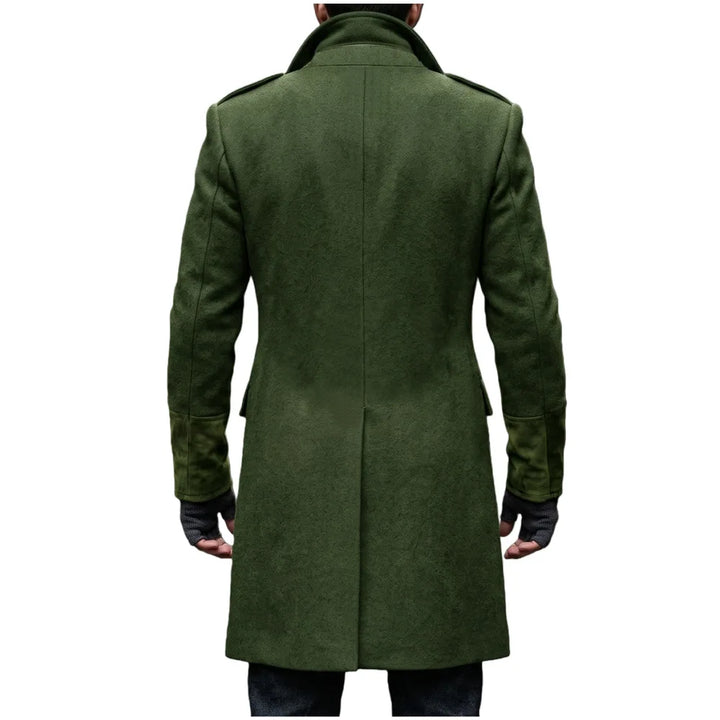 Back view of the olive green overcoat on a model, showing the center seam, epaulettes and suede-look cuffs 6