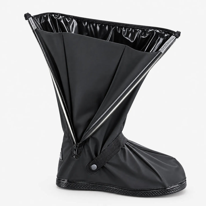 Black tall shoe cover standing alone with its side zipper fully open, showing the glossy lining and elastic ankle strap. 5