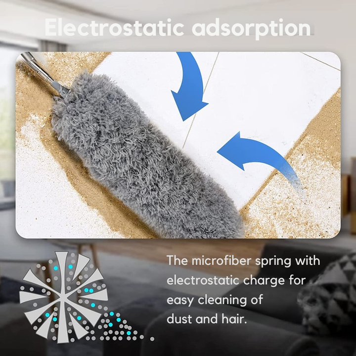 Close-up of the gray microfiber head sweeping sand and dust off a white tile floor, with arrows showing dust being drawn in. 5