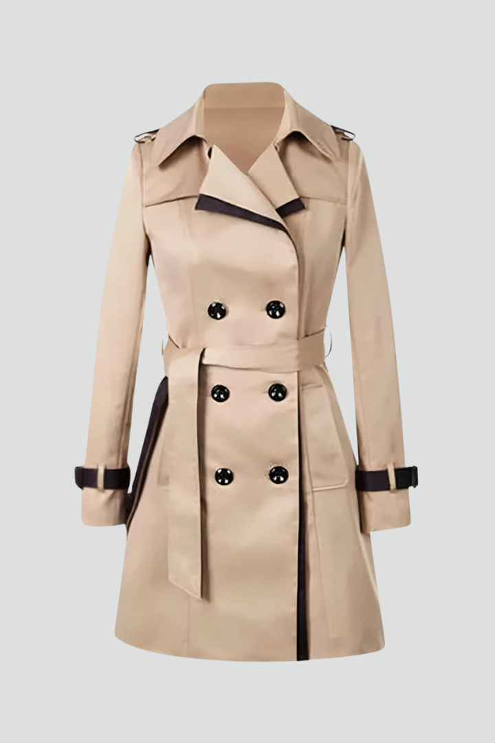 Beige double-breasted trench coat with black trim, buttoned cuff straps and a tied belt, shown flat on a light gray background. 1