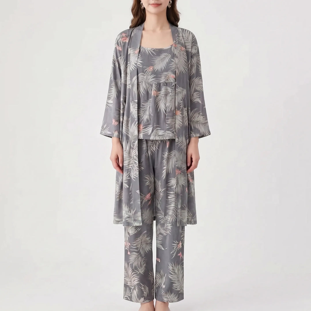 Front view of the set in dark gray with a pale palm-leaf print and touches of pink, worn by a model. 11