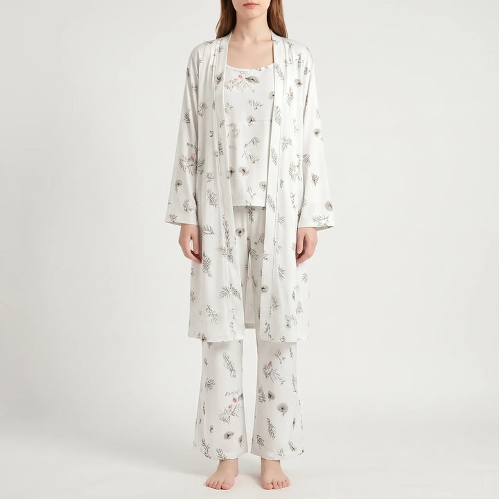 Front view of the set in white with a delicate gray leaf and small pink flower print, worn by a model. 8