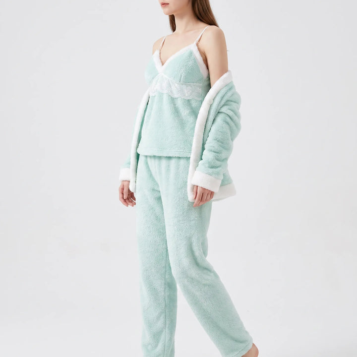 Side view of the camisole with lace panel and fur-trimmed neckline, cardigan draped over the arms, with matching pants. 4