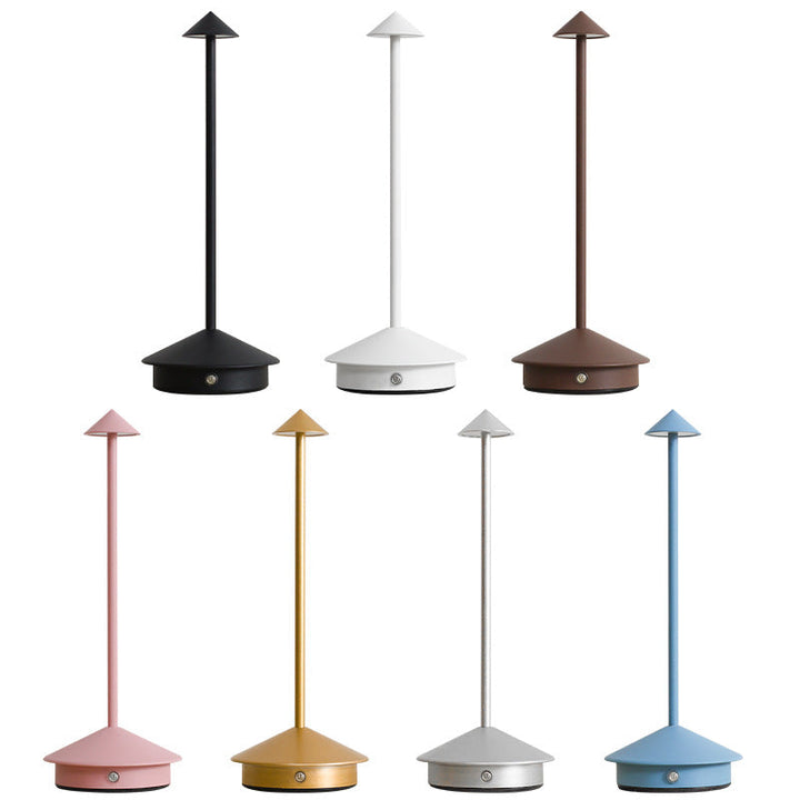 Studio lineup on a white background showing the multicolor lamp in black, white, brown, pink, gold, silver and blue.