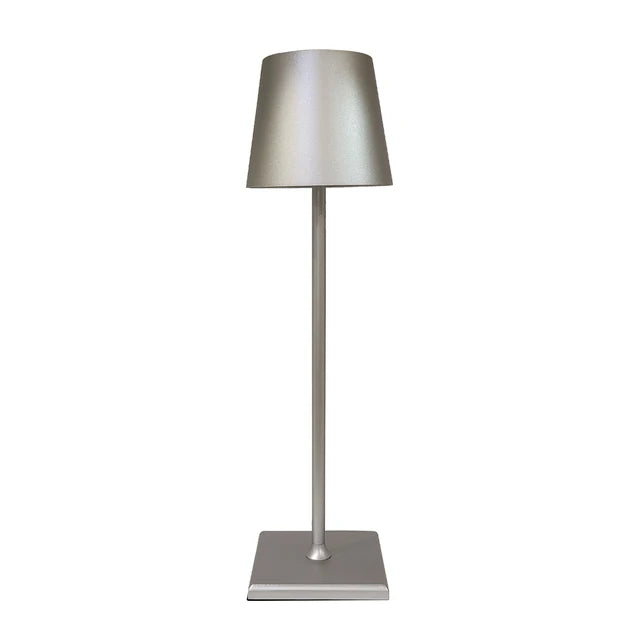 Silver lamp with a tapered shade, slim stem and square base on a white background.