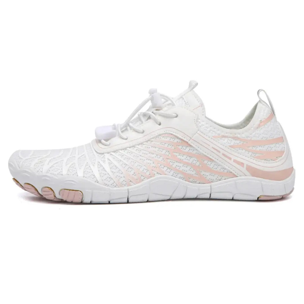 Left-side view of a white mesh barefoot shoe with pink wing-shaped overlays, elastic bungee laces and a flat, flexible sole.