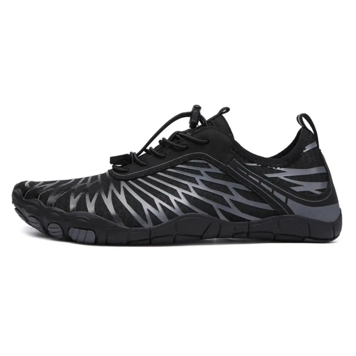 Left-side view of a black mesh barefoot shoe with gray wing-shaped overlays, bungee laces and a flat, flexible sole.