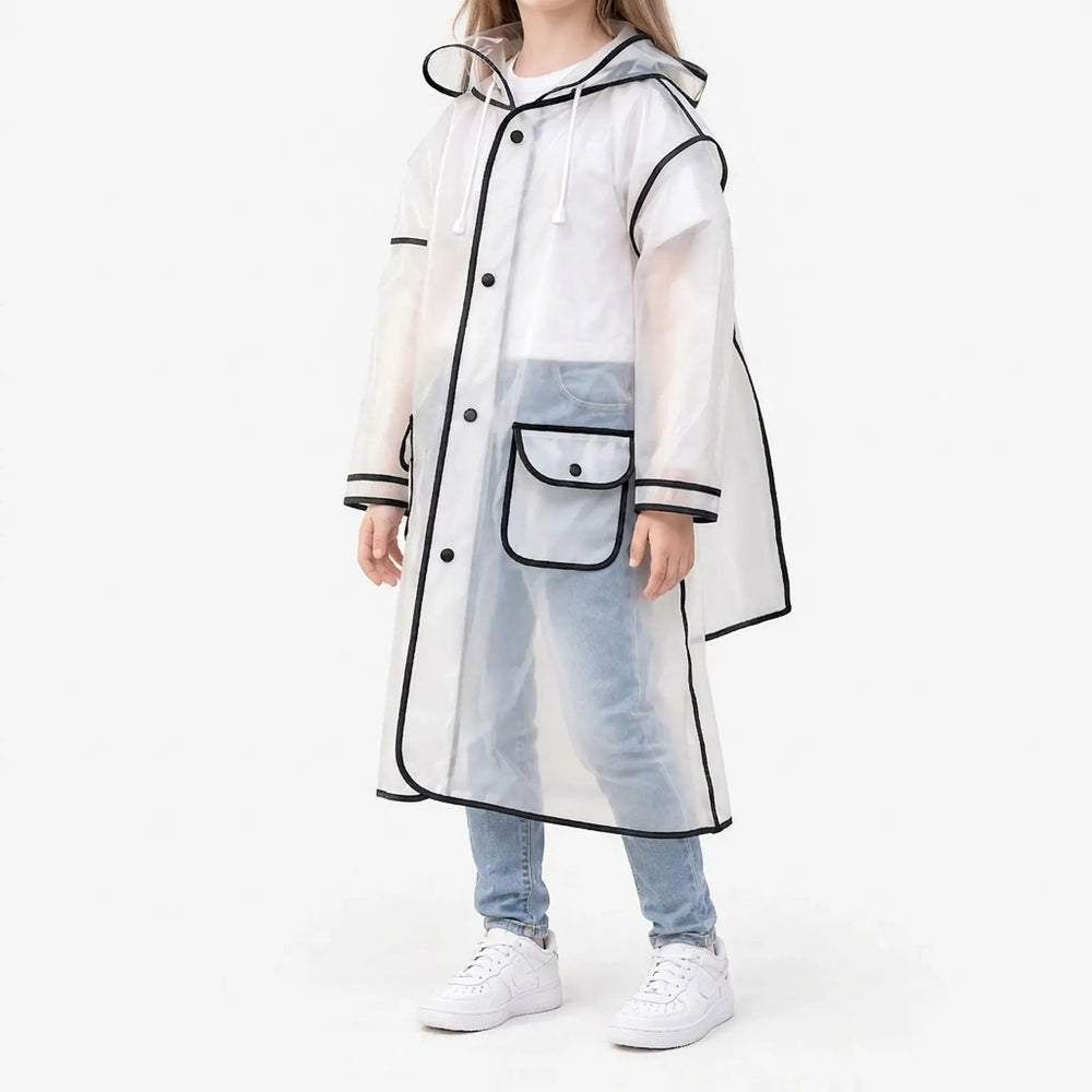 Side three-quarter view of a girl in the frosted raincoat with black trim, snap buttons, hood drawstrings and a flap pocket. 2
