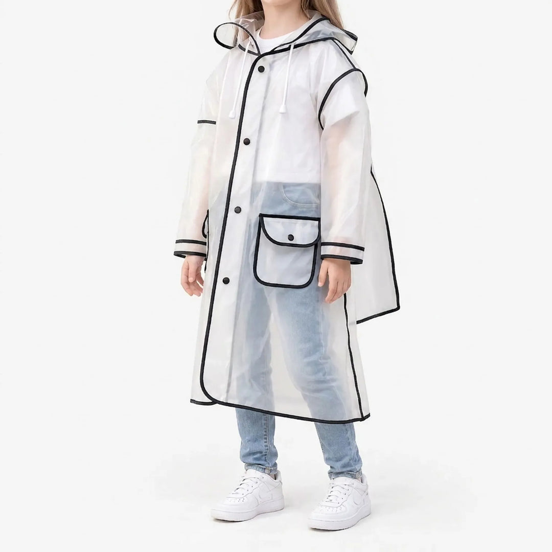Side three-quarter view of a girl in the frosted raincoat with black trim, snap buttons, hood drawstrings and a flap pocket. 2