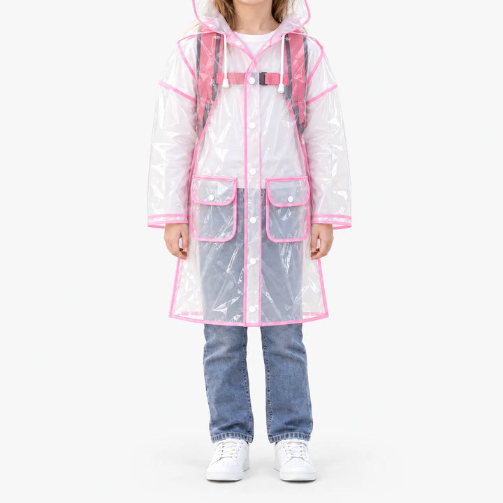 Front view of a girl wearing the glossy see-through raincoat with pink trim over a pink backpack, snaps closed, two flap pockets. 8