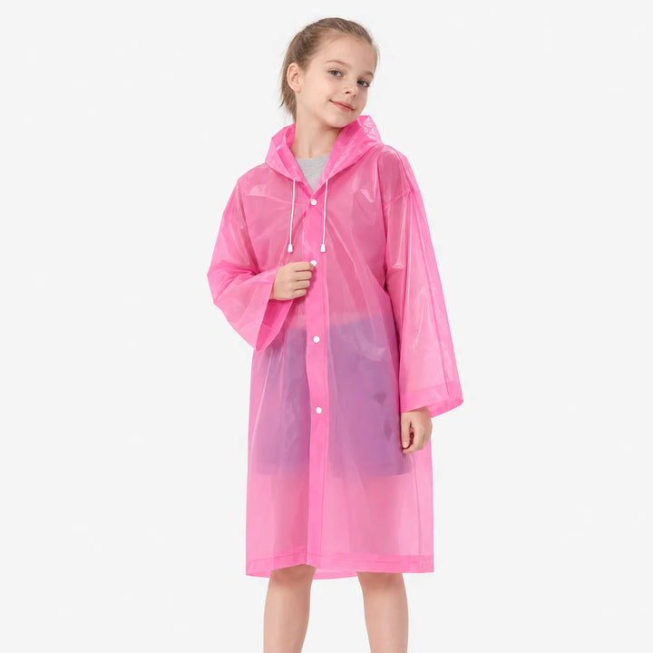 Girl smiling in the pink translucent raincoat with hood drawstrings and snap buttons closed, posed against a white background. 4