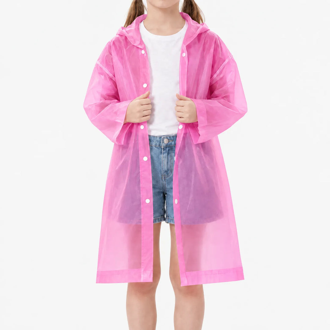 Girl in the pink translucent raincoat worn open over a white tee and denim shorts, snap buttons visible along the front. 8