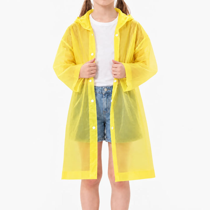 Girl in the yellow translucent raincoat worn open over a white tee and denim shorts, white snap buttons along the front. 9