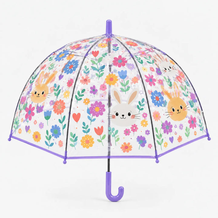 Clear dome umbrella with a purple trim and hook handle, printed with smiling bunny faces and colorful flowers, shown on white. 11