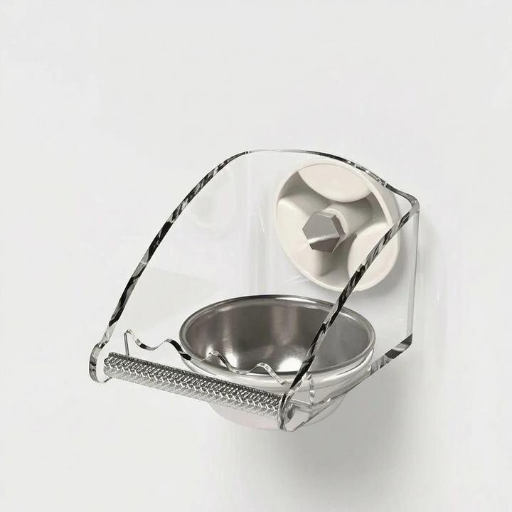 Angled view from the side showing the curved clear shield, a suction cup with hex bolt and the round steel dish. 4