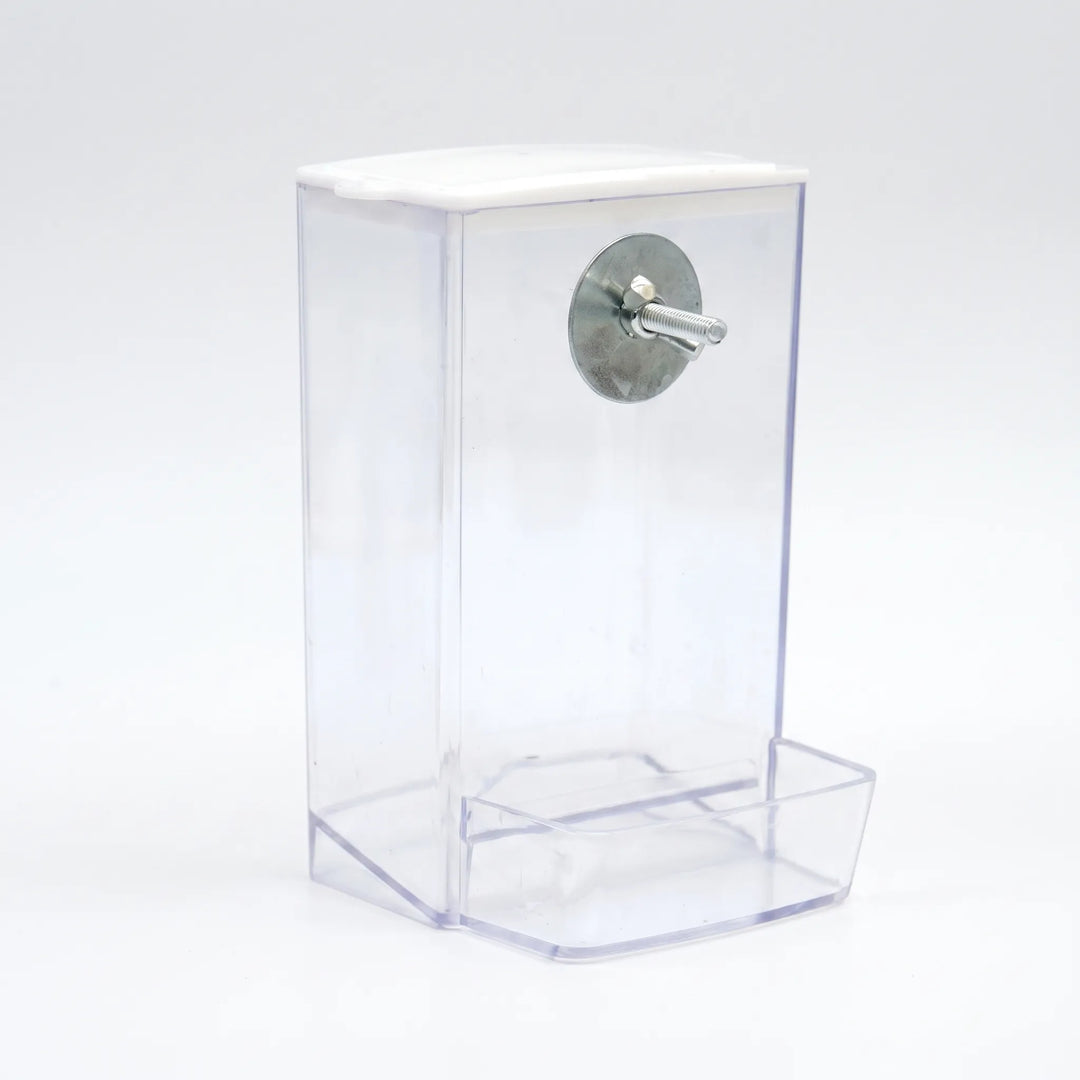 Empty clear feeder with white lid, angled view showing the metal washer and threaded bolt for mounting and the seed tray at the base. 4
