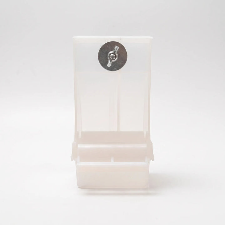 Back of the empty feeder in frosted translucent plastic, showing the metal washer and wing nut used to fasten it. 4
