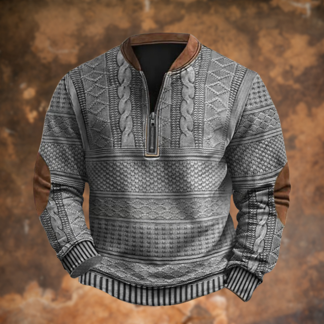 Front view in light gray with cable and diamond knit pattern, striped ribbed cuffs, brown collar and elbow patches. 5