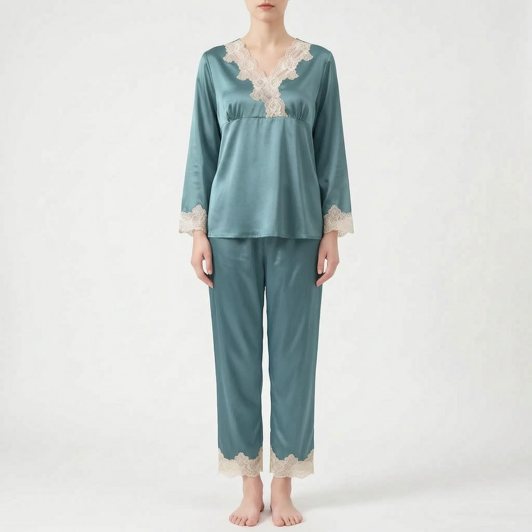 Front view of a model wearing the same lace-trimmed satin pajama set in a teal color. 7