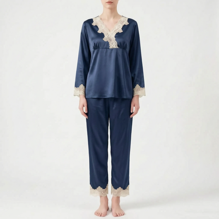 Front view of a model wearing the same lace-trimmed satin pajama set in a navy blue color. 8