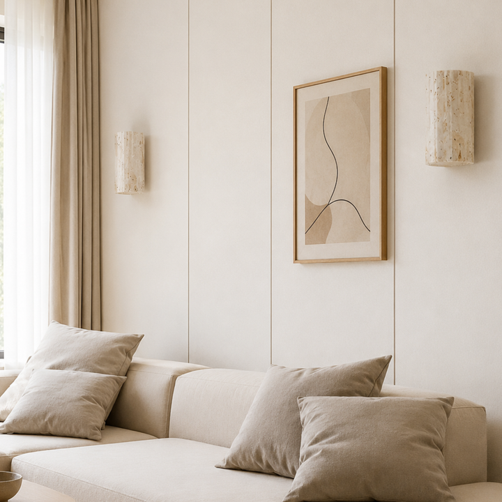 Natural Stone Wall Sconce Wall Light mounted on a paneled living room wall beside a framed print and sofa.