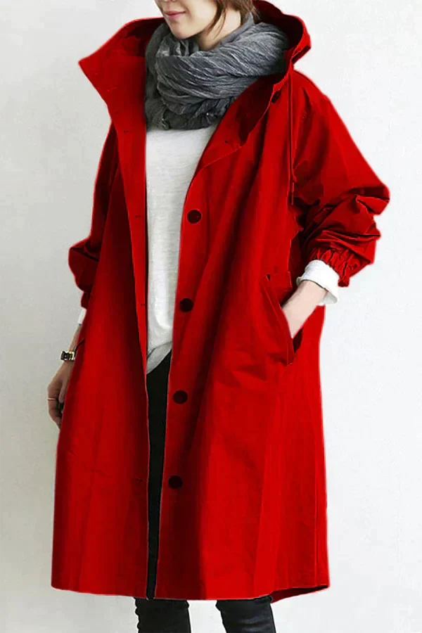 Bright red waterproof hooded trench coat front view with a scarf