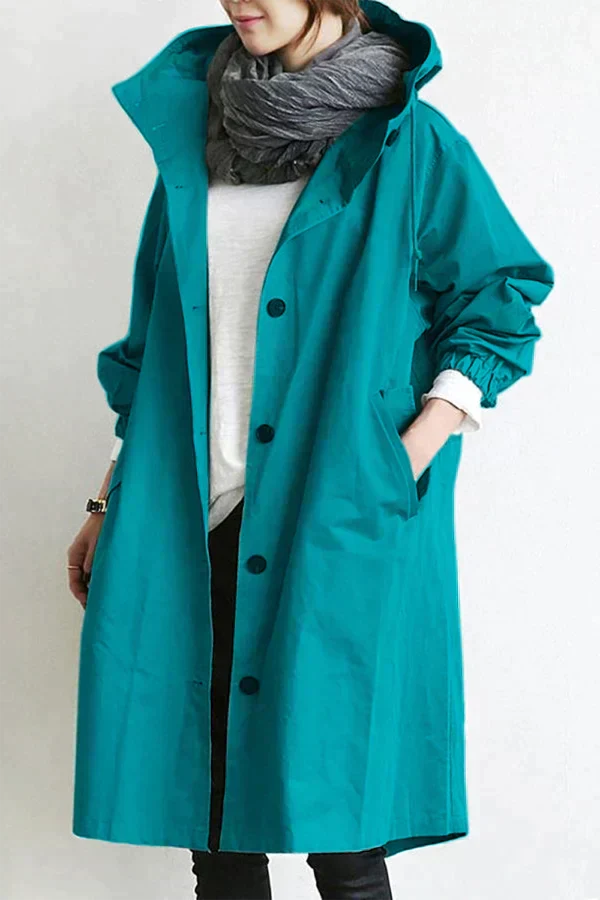 Teal waterproof hooded trench coat front view with a scarf