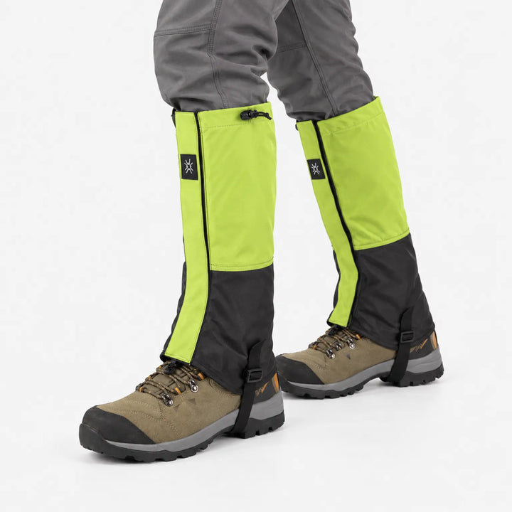 Lime green and black gaiters on hiking boots, shown mid-stride against a white background with drawcord closure at the top. 4