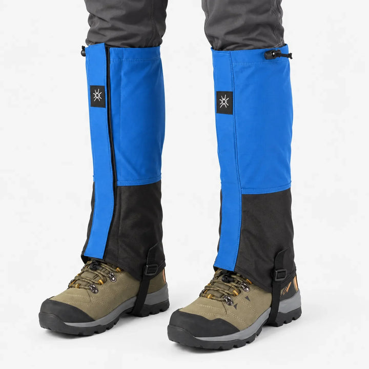 Front view of blue and black gaiters with drawcord tops worn over olive hiking boots, with instep straps visible. 7