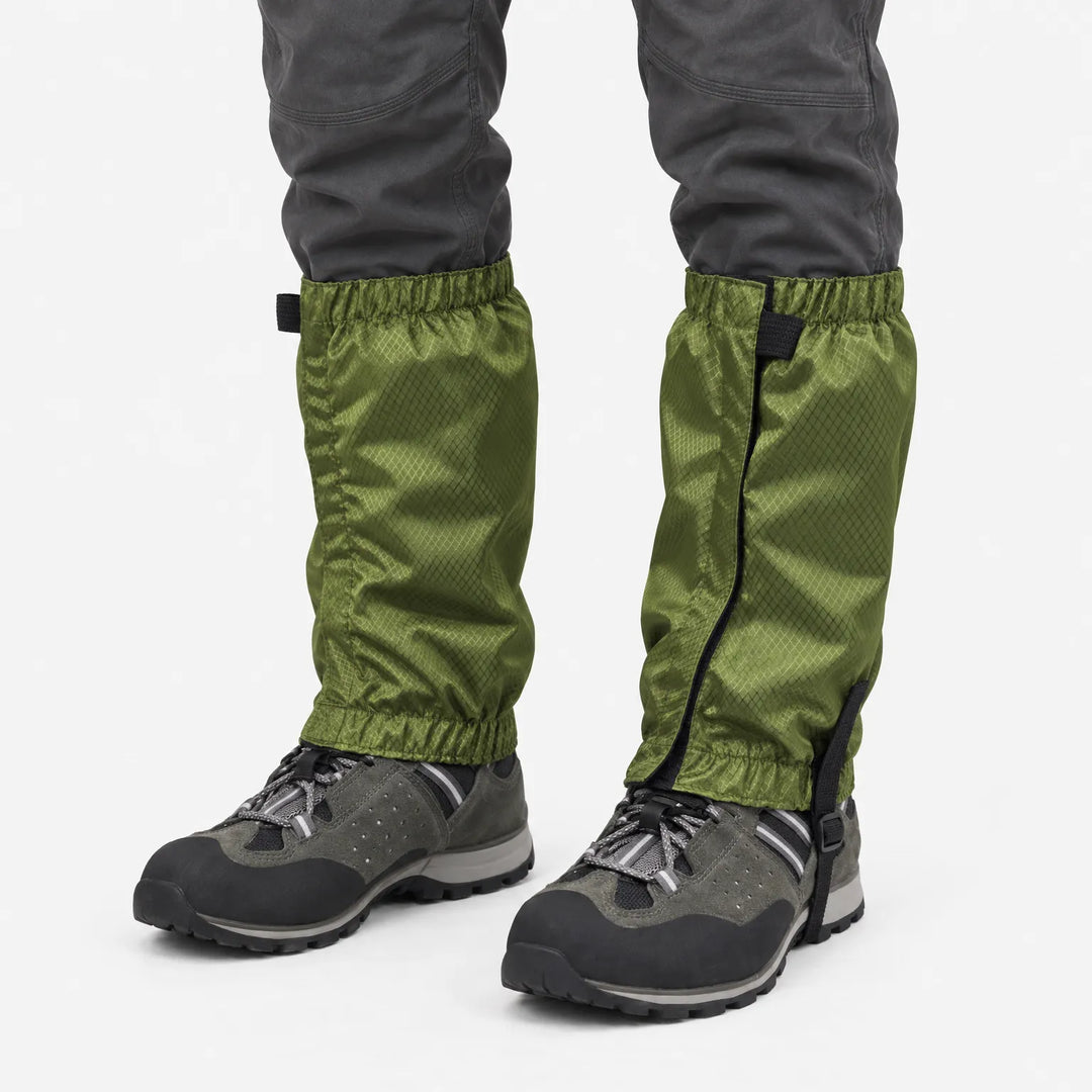 Olive green ripstop gaiters with elastic cuffs and an instep strap, worn over gray hiking shoes against a plain white background. 2