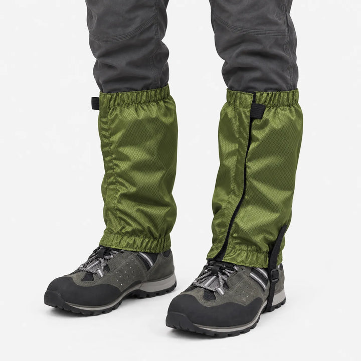 Olive green ripstop gaiters with elastic cuffs and an instep strap, worn over gray hiking shoes against a plain white background. 2