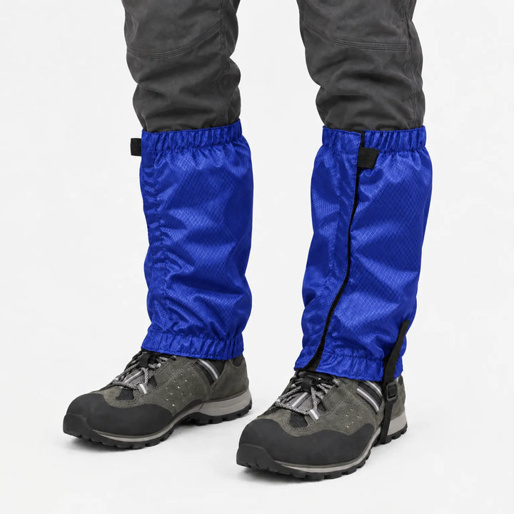 Bright blue ripstop gaiters with black instep strap, worn over gray hiking shoes and dark pants against a white background. 8
