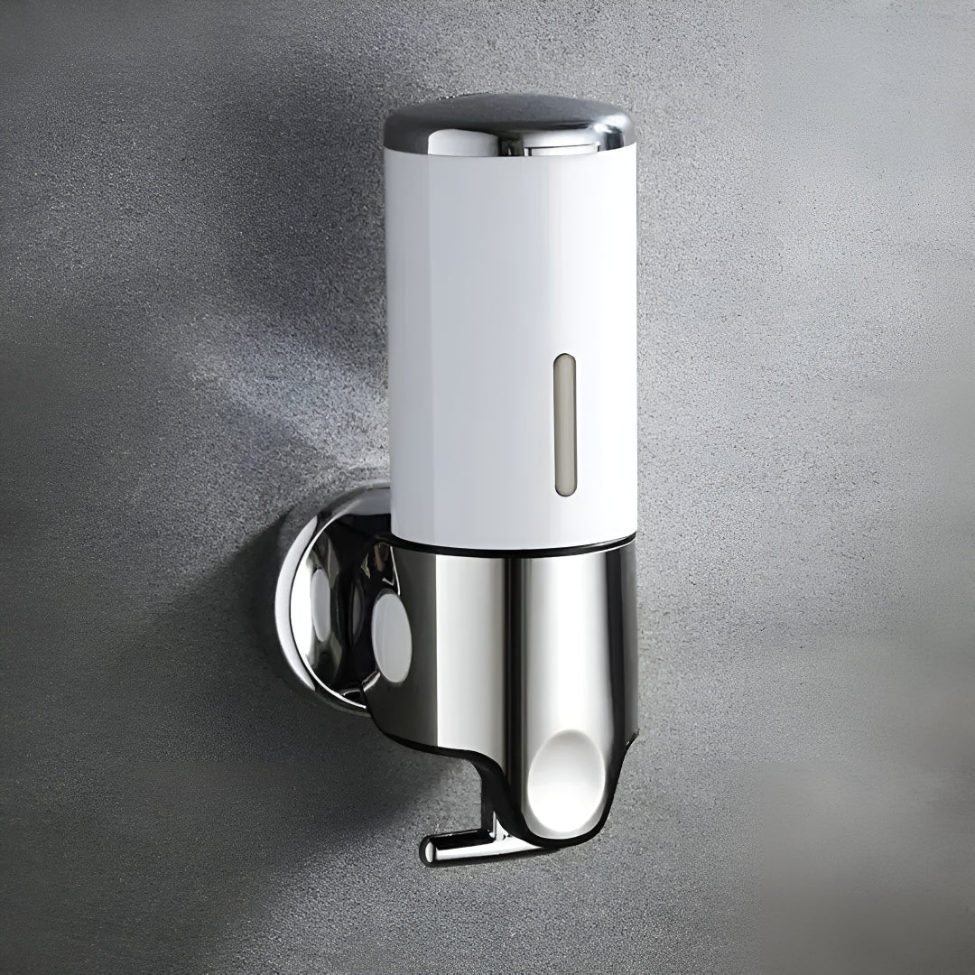 Wall-mounted white soap dispenser, detail.