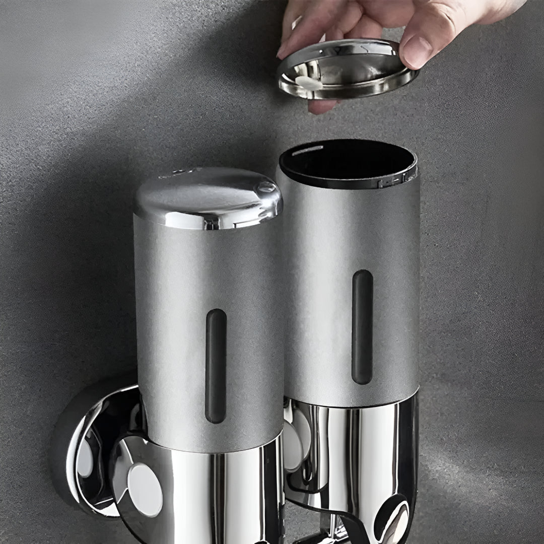 Wall-mounted white soap dispenser with the lid open for refilling.