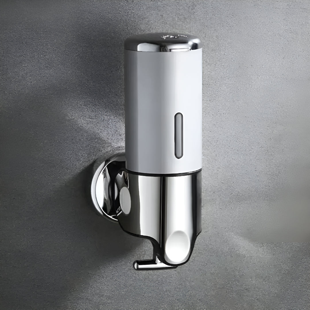 Wall-mounted white soap dispenser, detail.