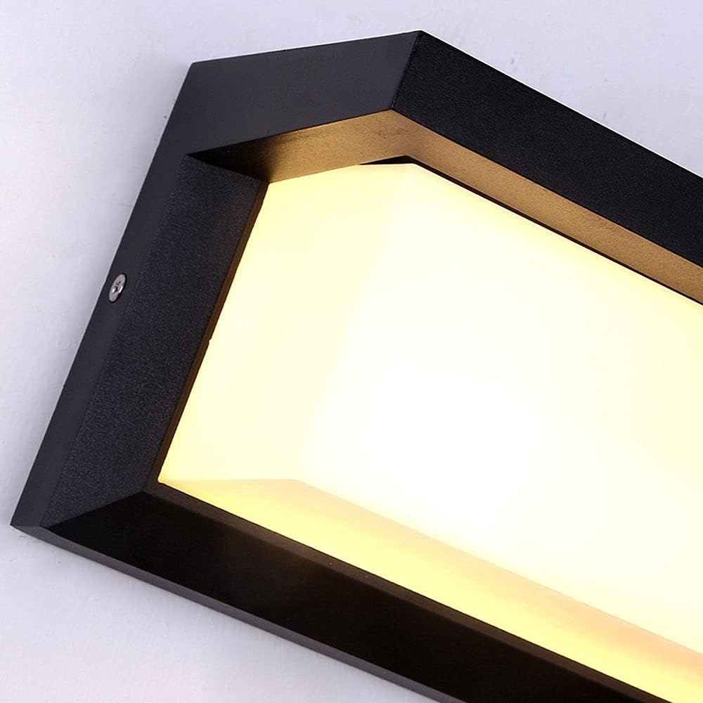 Close-up of the black frame corner, screw detail and frosted white diffuser lit with warm light. 2