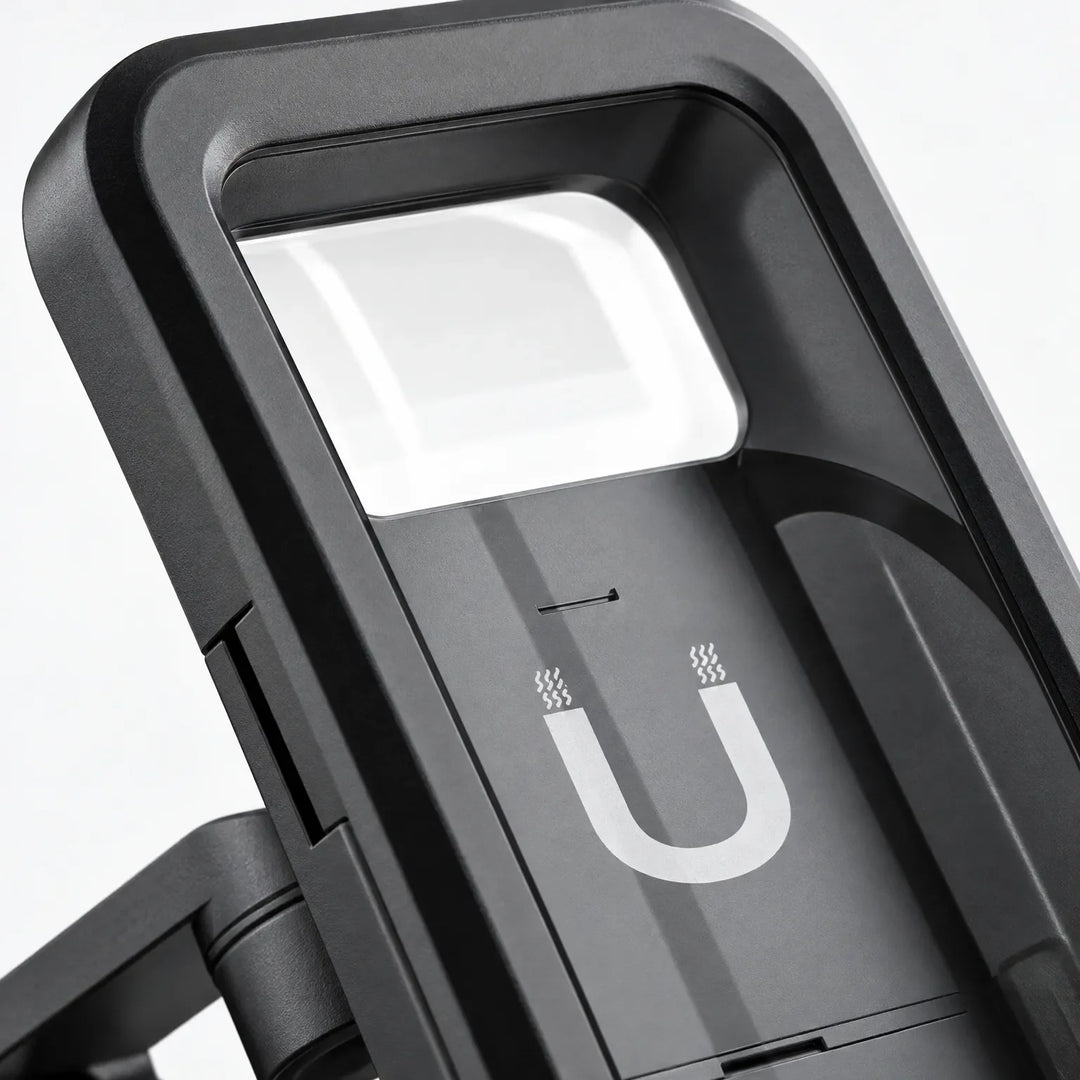Close-up of the holder's black frame, clear top window and the magnet symbol on its back plate. 3