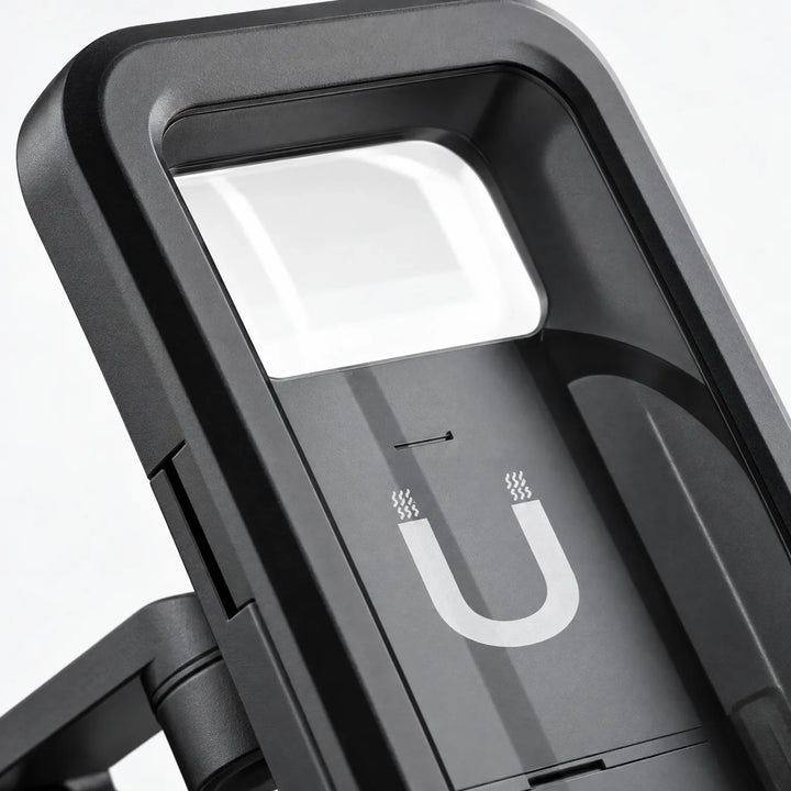 Close-up of the holder's black frame, clear top window and the magnet symbol on its back plate. 3