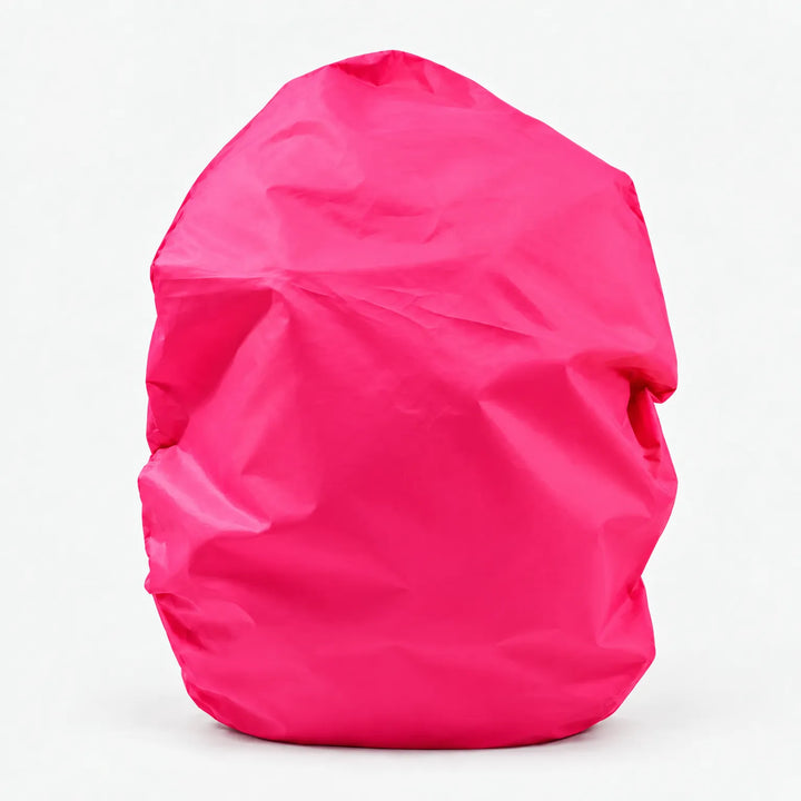 Hot pink backpack cover shown alone on a white background, front view with soft creases in the fabric. 11