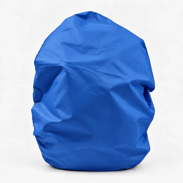 Royal blue backpack cover standing alone on a white background, front view with soft creases in the fabric. 7