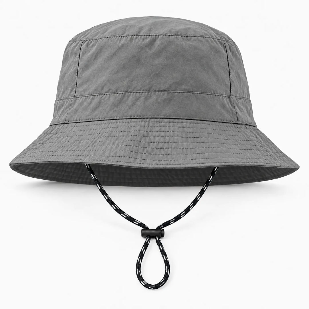Front view of a gray bucket hat with a wrinkled matte fabric, stitched brim and a black-and-white drawcord with toggle. 10