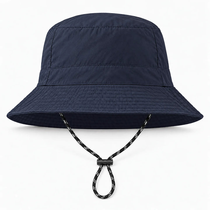 Front view of a navy blue bucket hat with a stitched brim and a black-and-white chin cord with a black toggle. 13