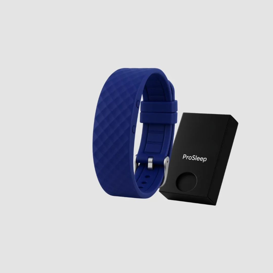 Navy blue silicone vibration alarm clock detail with a metal buckle beside a small black gift box.