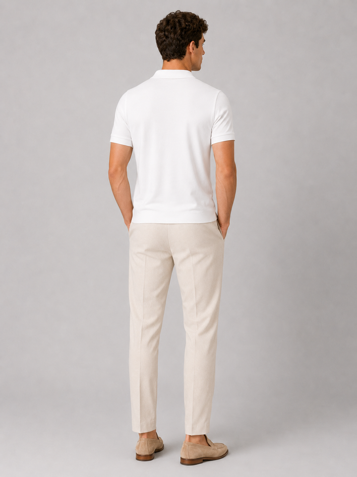 White silky touch polo shirt back view on a model.