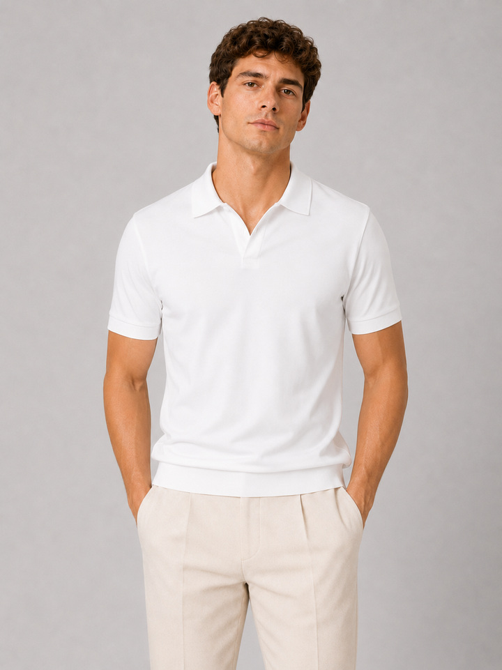 White silky touch polo shirt with open V placket, front view on a model.