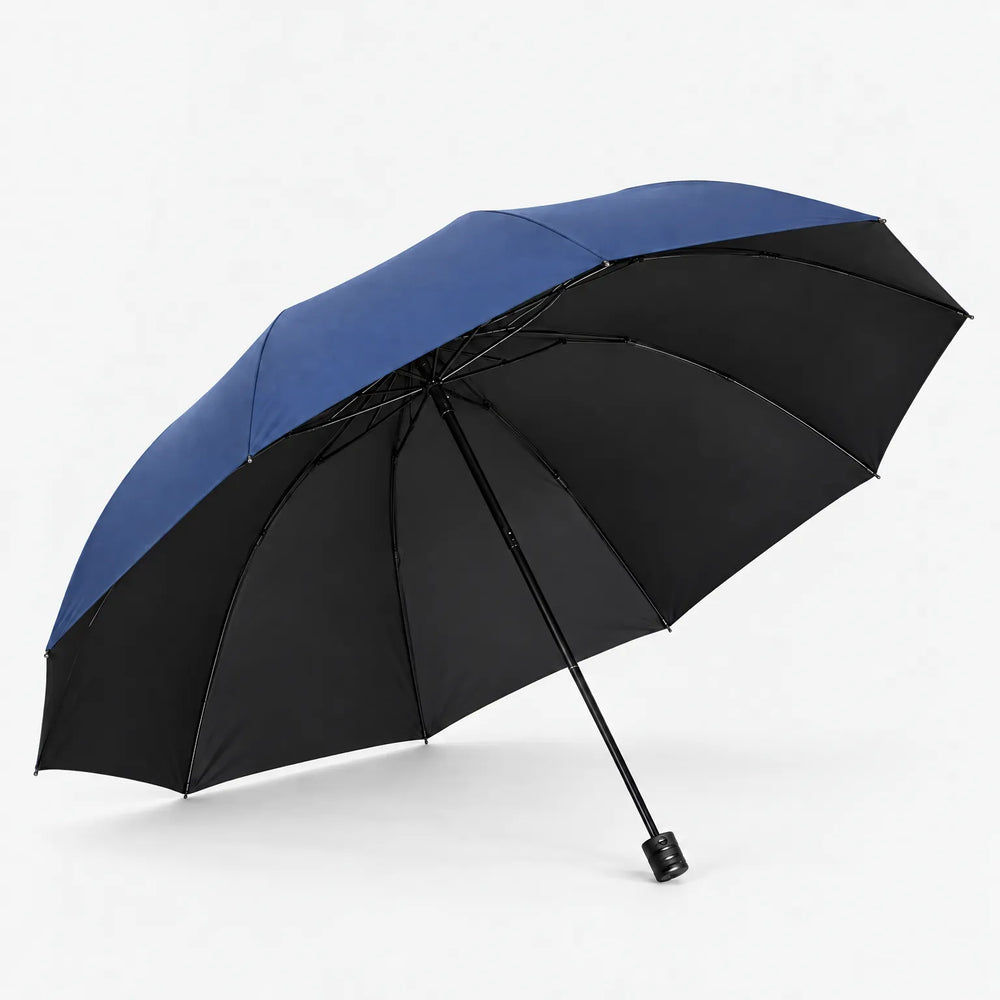 Open navy blue umbrella tilted to show its black underside, ribbed frame and black handle against a white background. 2