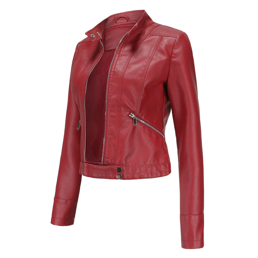 Red cropped jacket in three-quarter view, open at the front, showing the angled zipper pocket and snap waist tab. 10