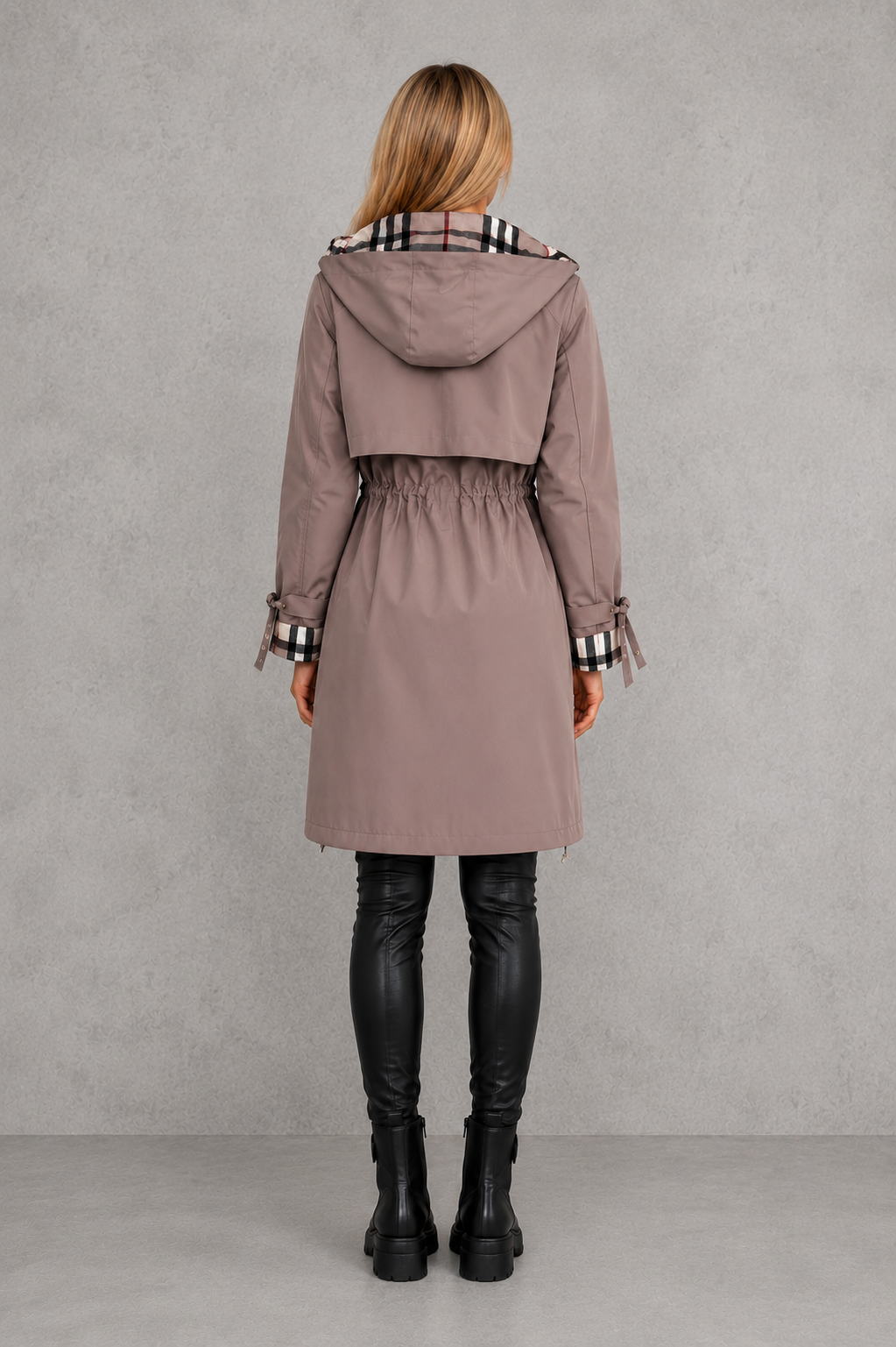 Back view of the mauve hooded coat showing the storm flap, gathered drawstring waist, checked hood lining and tie cuffs. 6
