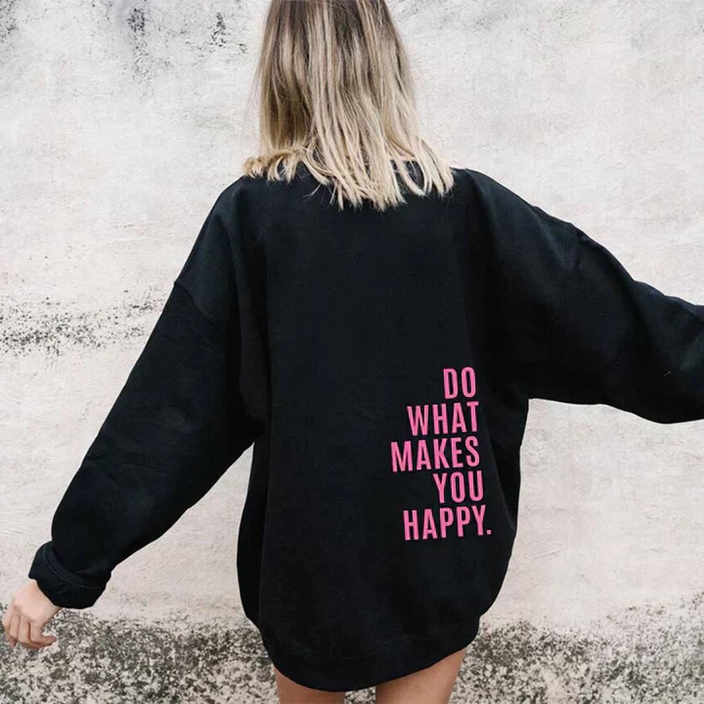 Women's Hoodie with Kangaroo Pocket and Thumb Holes in black with a pink slogan on the back.